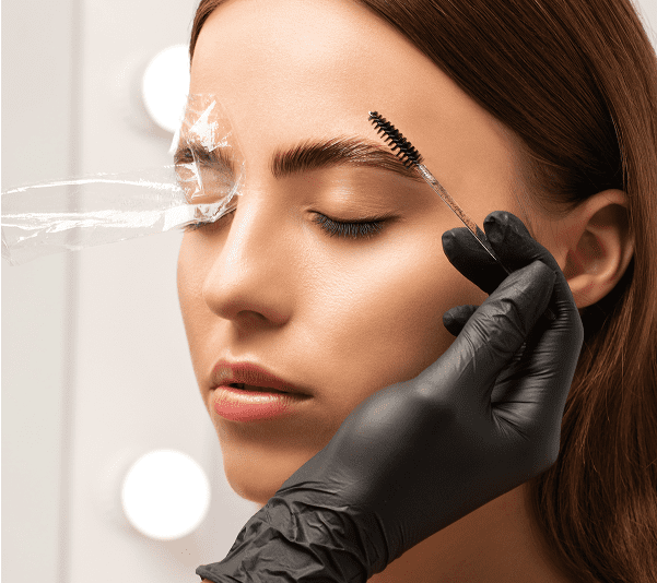 Eyebrow lamination process on a woman's face.